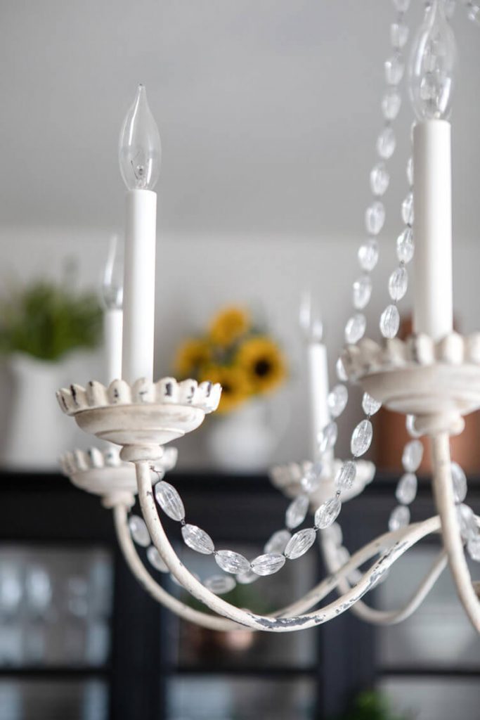 white rustic chandelier and beaded crystal string 