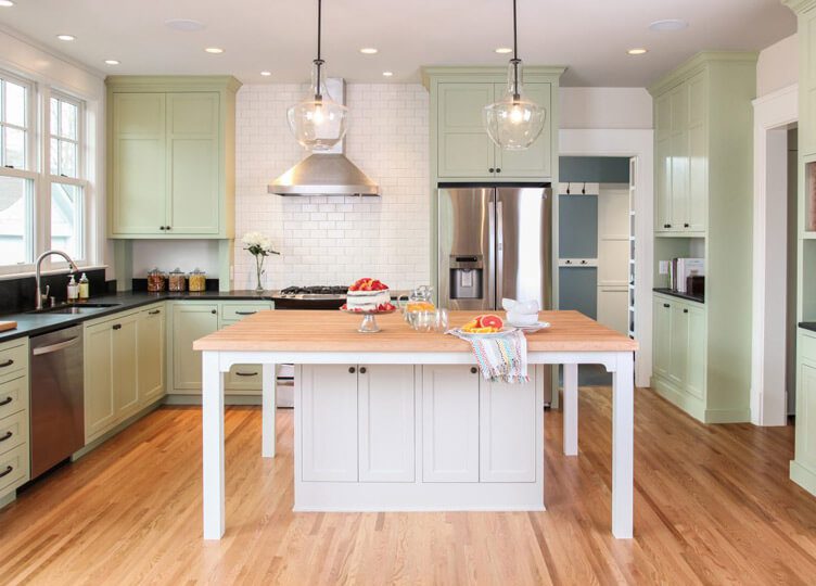 kitchen countertop with colorful green cabinets in the background