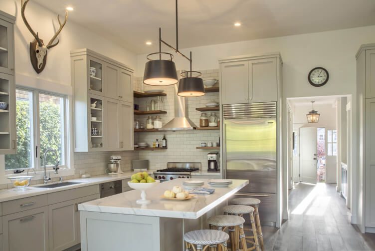 A functional kitchen that opens into a hallway that leads to the front door.