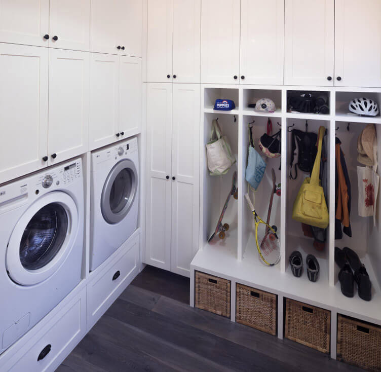 A laundry room with lots of functional storage space.