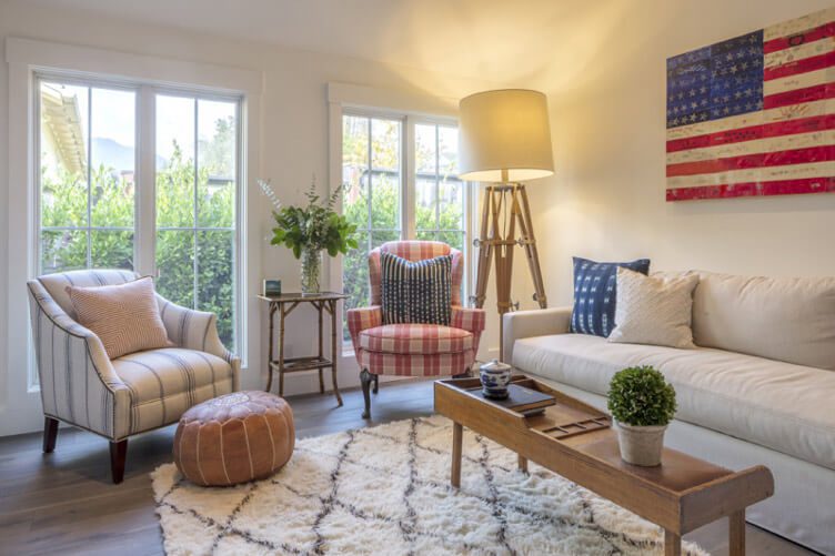 A white living room with red and blue accents.