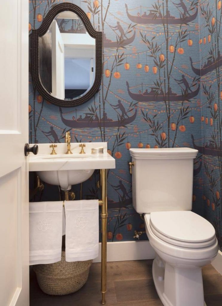 A bathroom with a modern bathtub and exposed bulb.