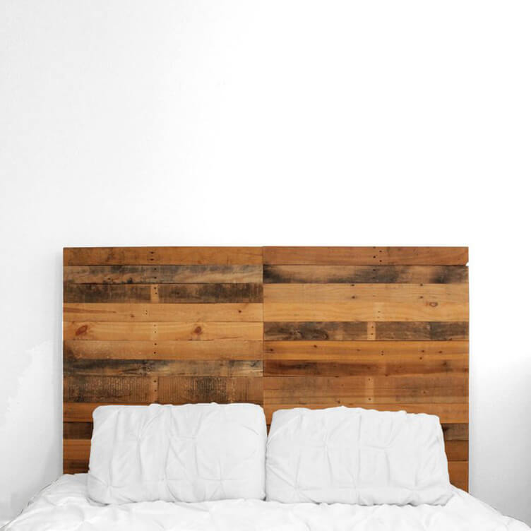 pallet wood headboard with white pillows and bed sheets. 