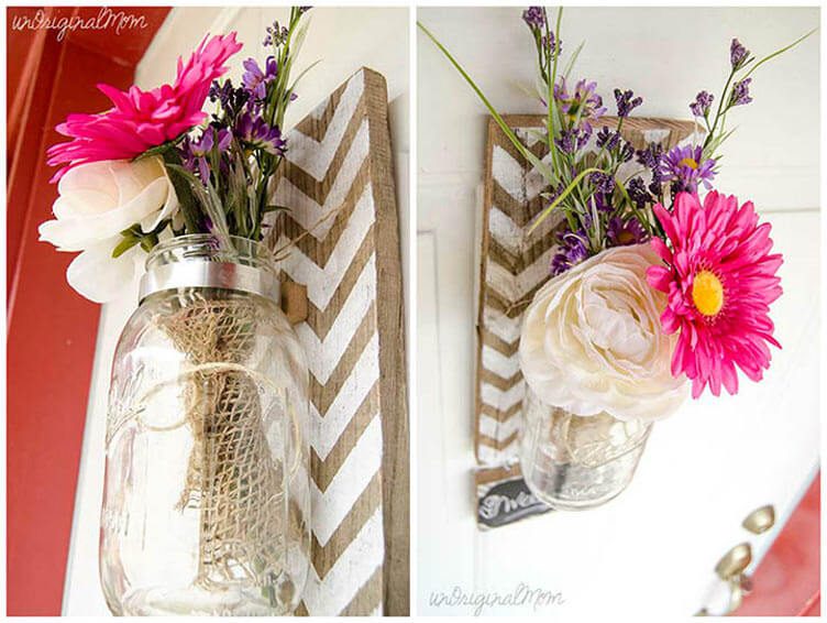 mason jar vase attached to painted pallet board and hung on a wall 