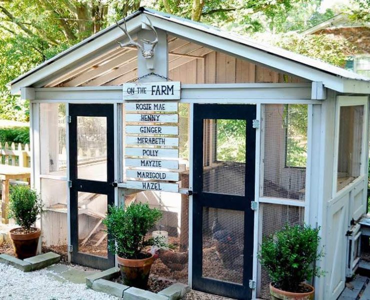 rustic white chicken coop with name plaques