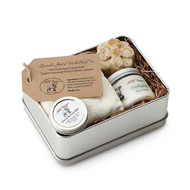 A box of skincare that includes bath truffle and whipped shea cream