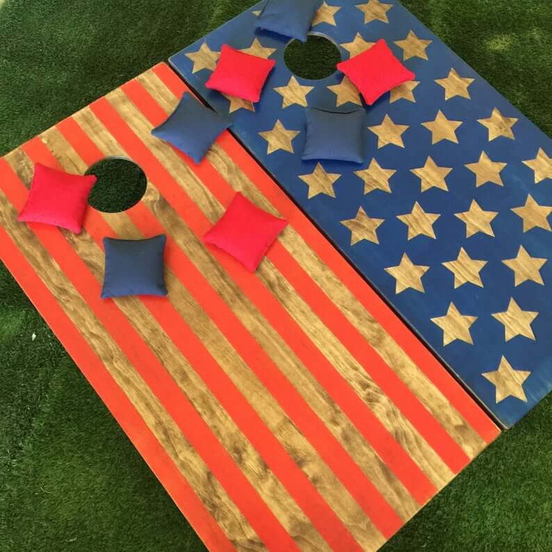 Cornhole game painted with red white and blue