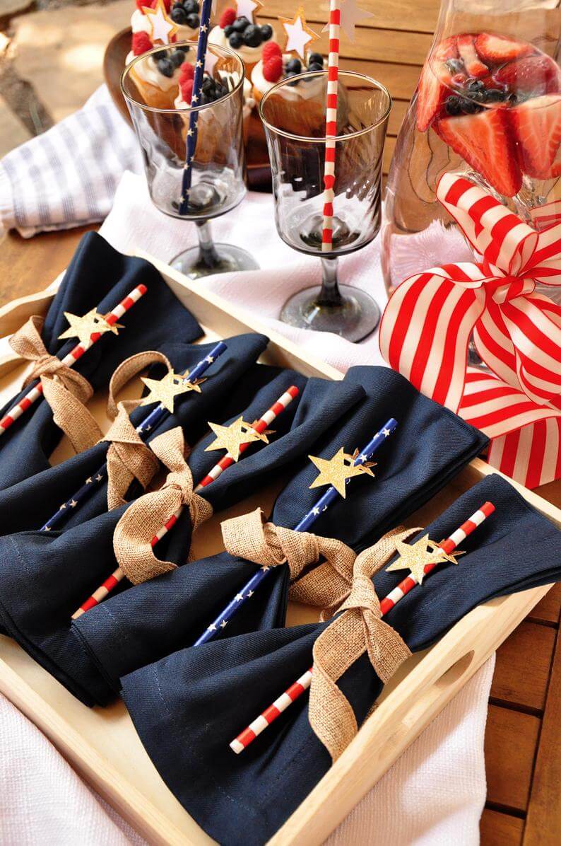 A set of five Fourth of July striped party straws with a small star decal on each one