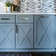 Ash grey cabinets with X wood carving