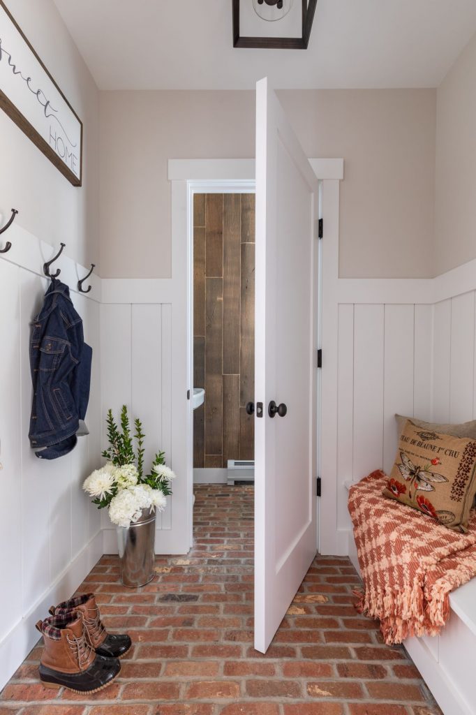 Brick flooring in farmhouse mudroom Springfield Barn project house.