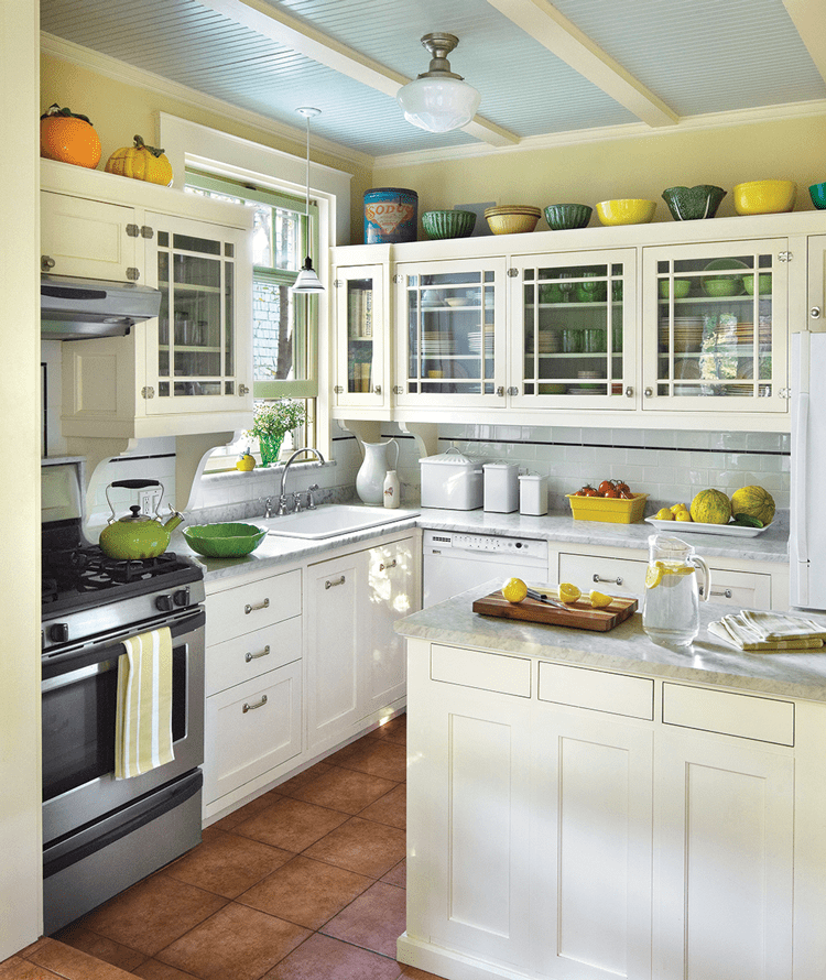 Historic farmhouse kitchen with glass planed cabinets and window