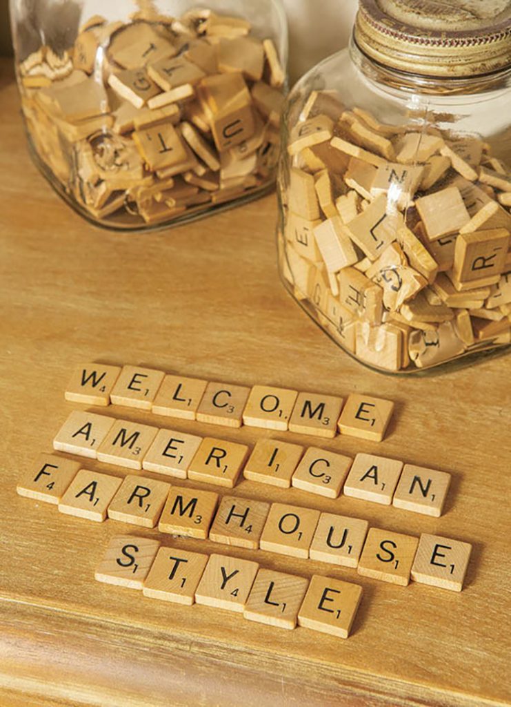 Vintage mason jars filled with scrabble tiles.