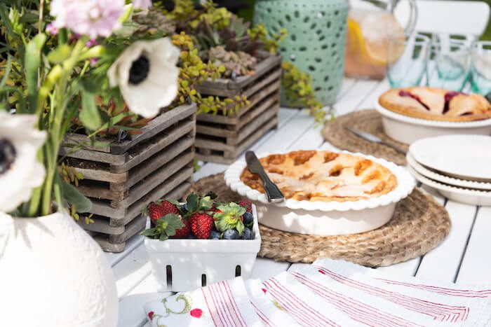 Outdoor dinner party table with strawberries