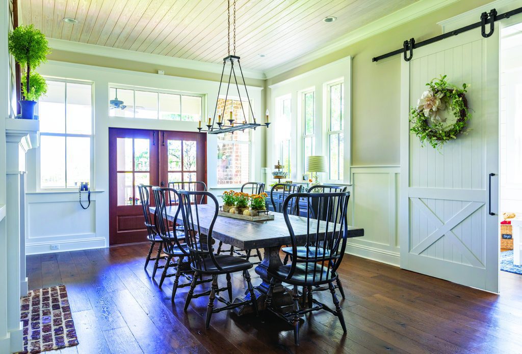Farmhouse dining room with white walls and black accents - choose the right builder