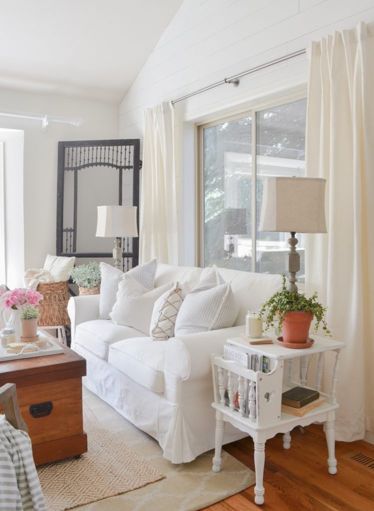 Front seating area with white, tan, and pops of color from Sarah Joy Blog