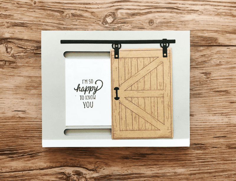 Birthday cards depicting a sliding barn door, with the words “I’m so happy to know you” depicted to the left of it