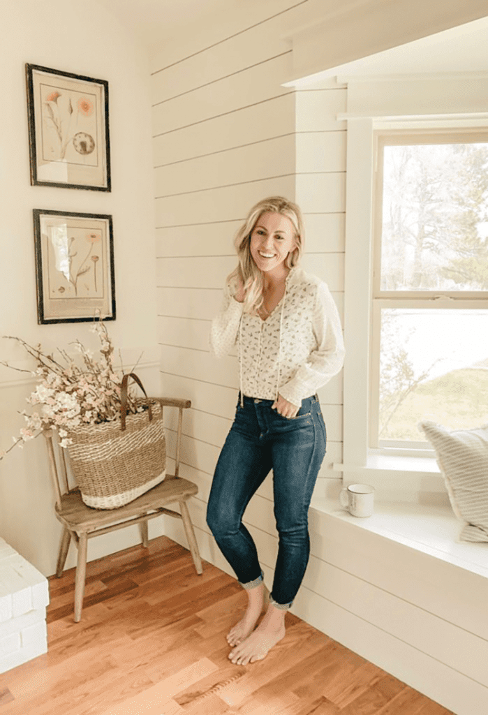 Sarah of Sarah Joy Blog standing in living room