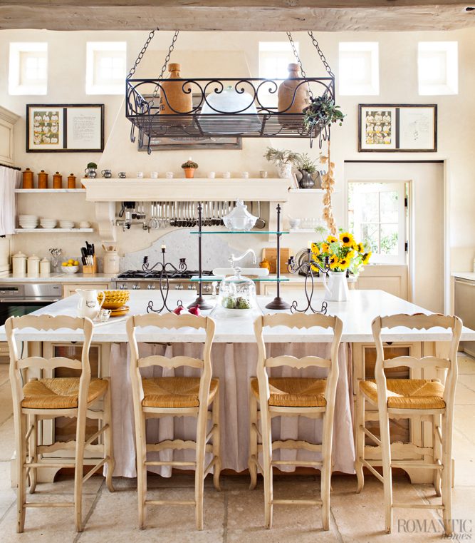 french farmhouse style kitchen with open shelves and window