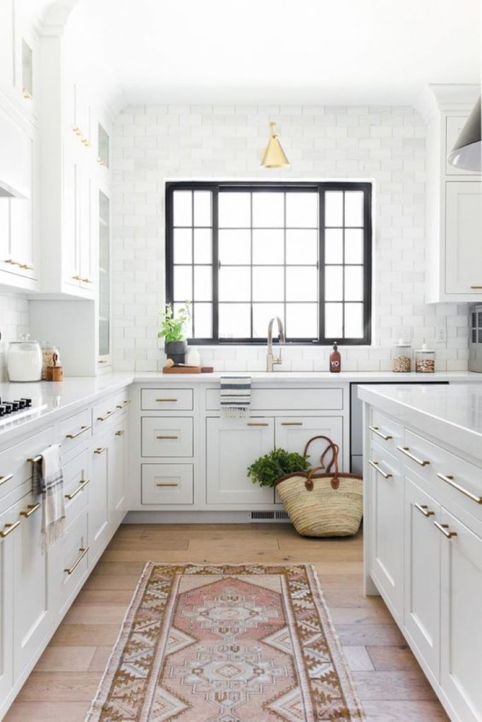 White kitchen with black-framed windows