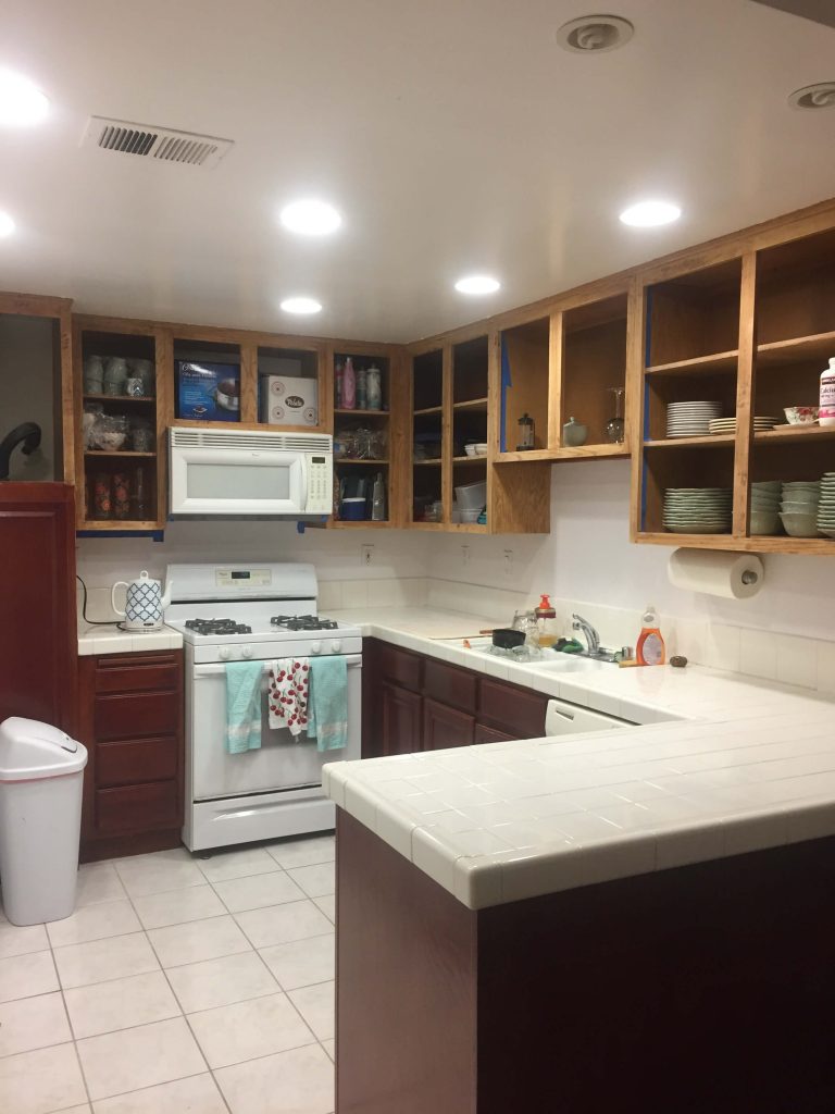 Upper kitchen cabinets stripped to repaint kitchen cabinets