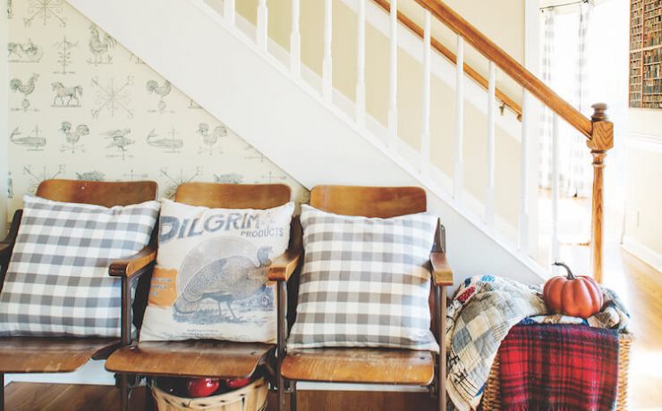 Farmhouse fall entryway with plaid textiles