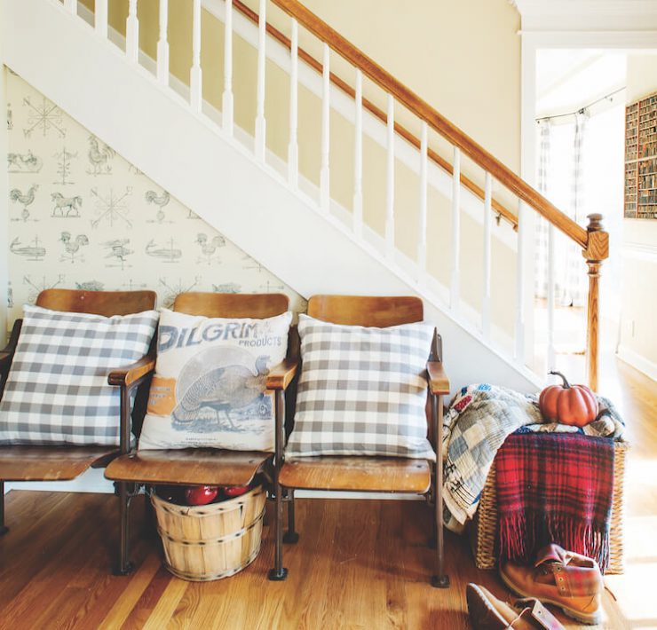 Farmhouse fall entryway with plaid textiles