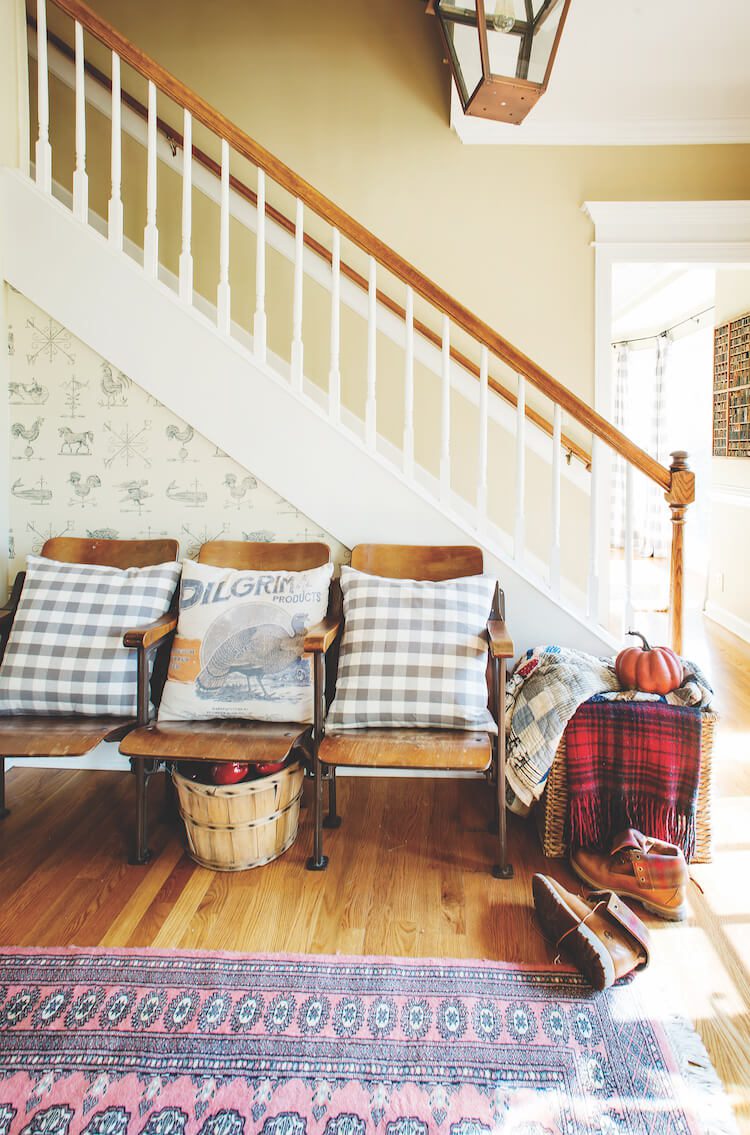 Farmhouse fall entryway with plaid textiles