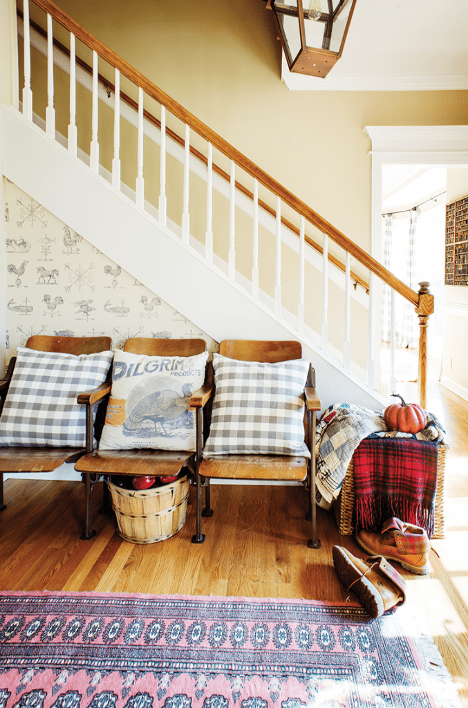 mid century farmhouse with vintage movie seats in entryway