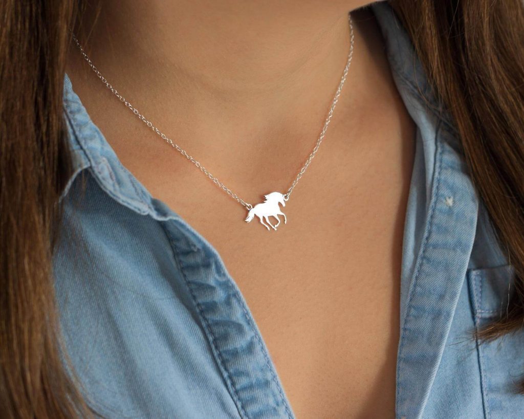 A birthday gift, sterling silver necklace complete with a small horse charm