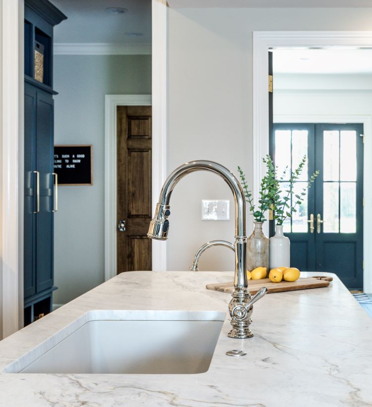 A kitchen remodel with white marble