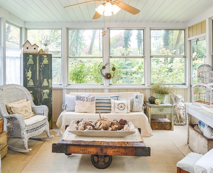 enclosed porch decorated for fall