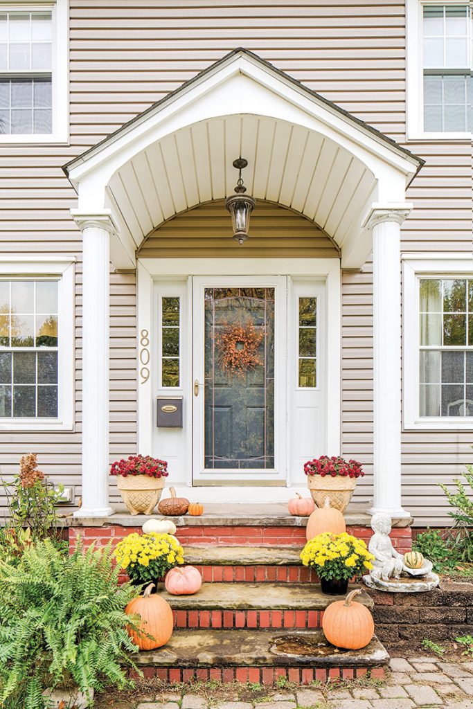 front porch of colonial flea market inspired farmhouse