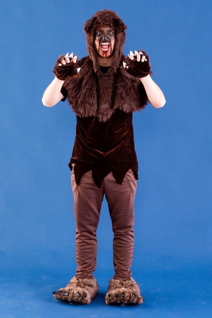 Adult bear costume made with brown sweatpants, velvet shirt, fur hat, slippers and gloves.