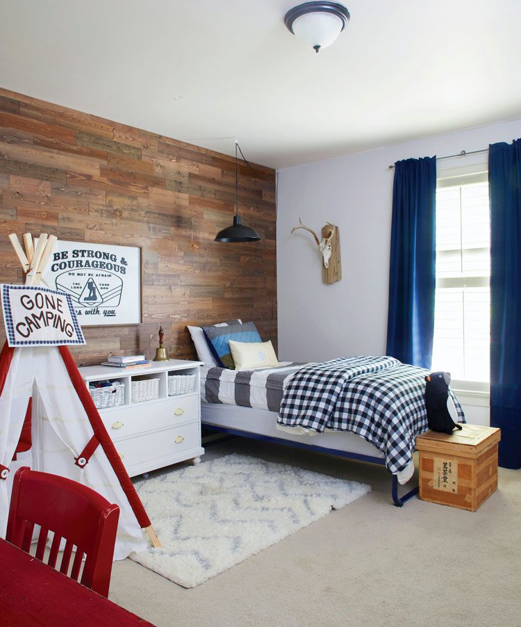 fall farmhouse boys bedroom with wood accent wall