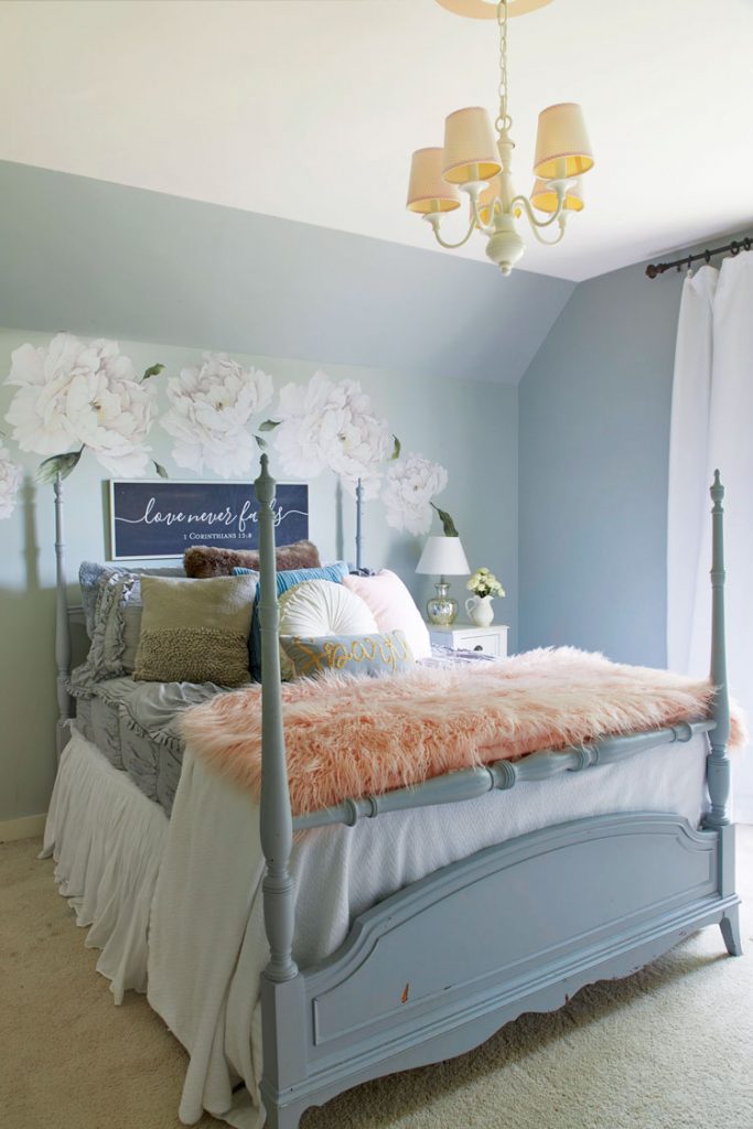 fall farmhouse bedroom with 4 poster bed and blue mural