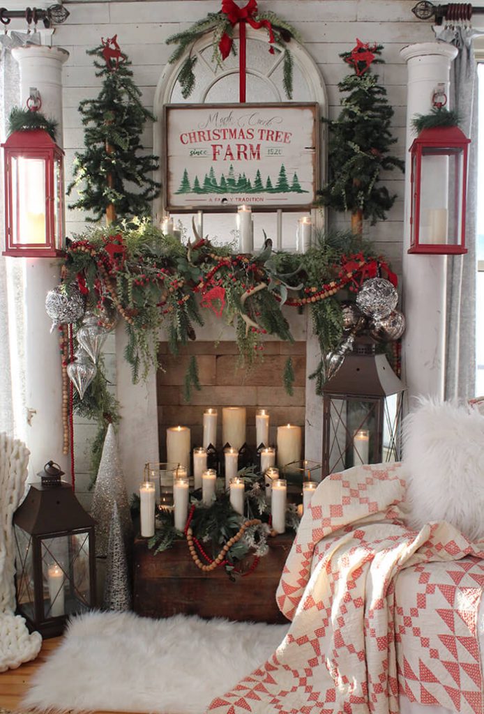 Faux fireplace with red and green Christmas decorations