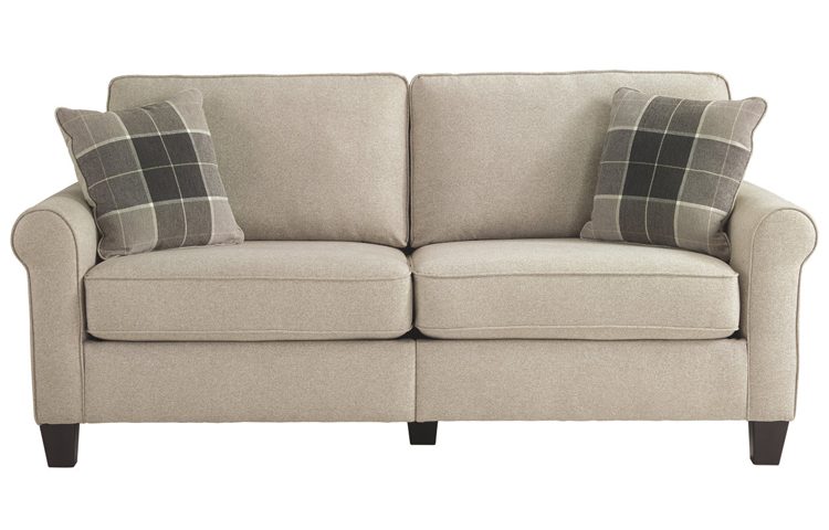 Ecru plush fabric loveseat with rounded armrests.
