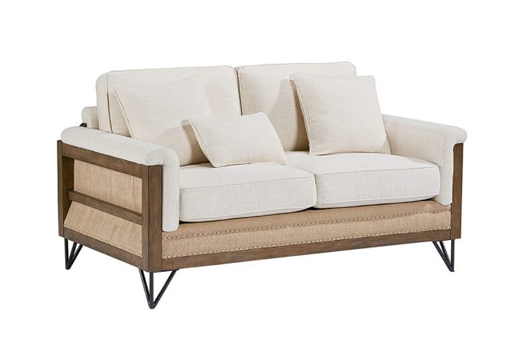Off-white fabric loveseat with wood and metal bottom and sides.