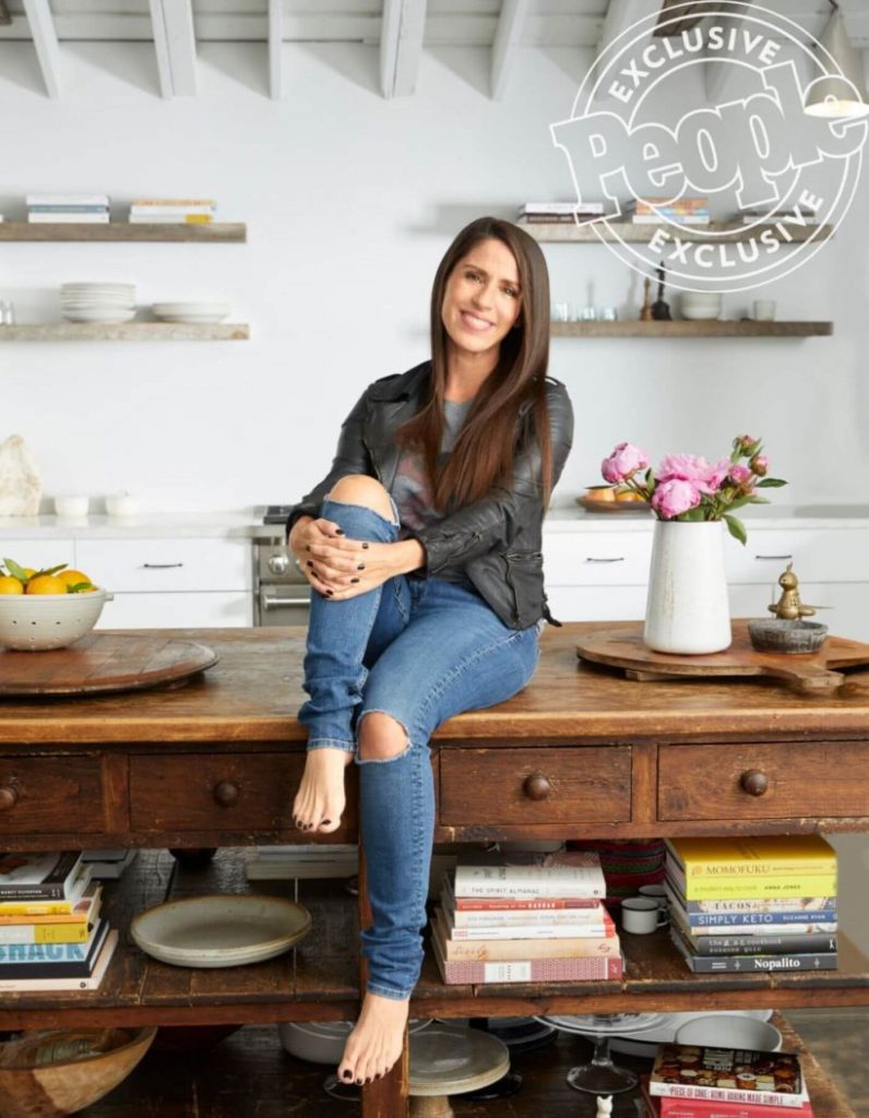 Soliel Moon Frye sits on her rustic farmhouse table