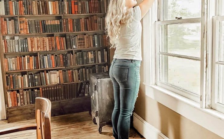 Woman in library fits her window