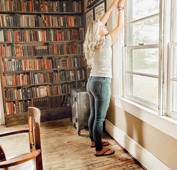 Woman in library fits her window