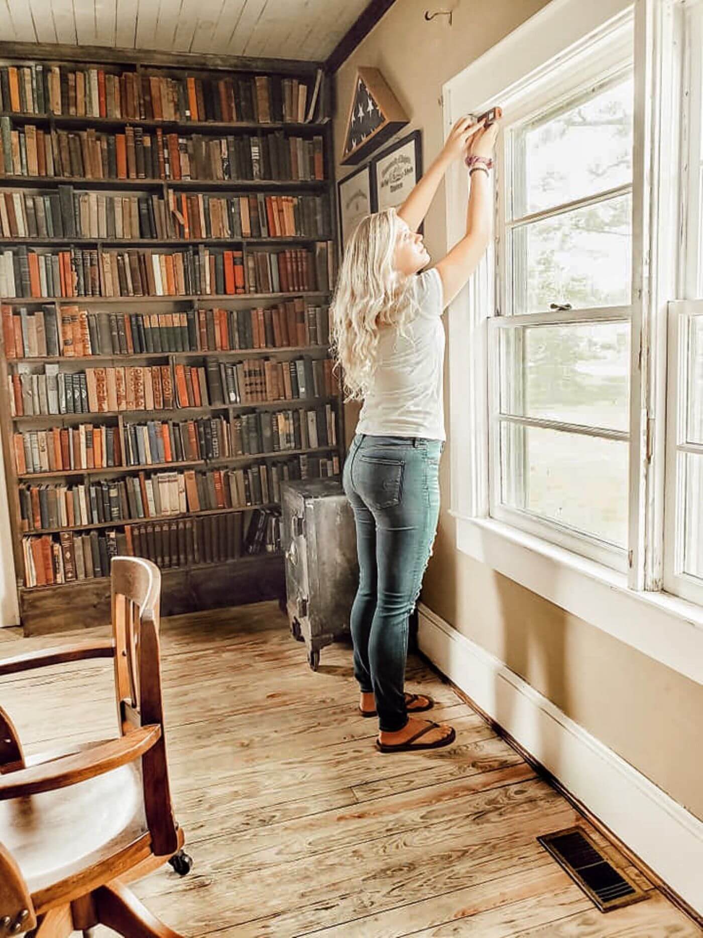 Woman in library fits her window