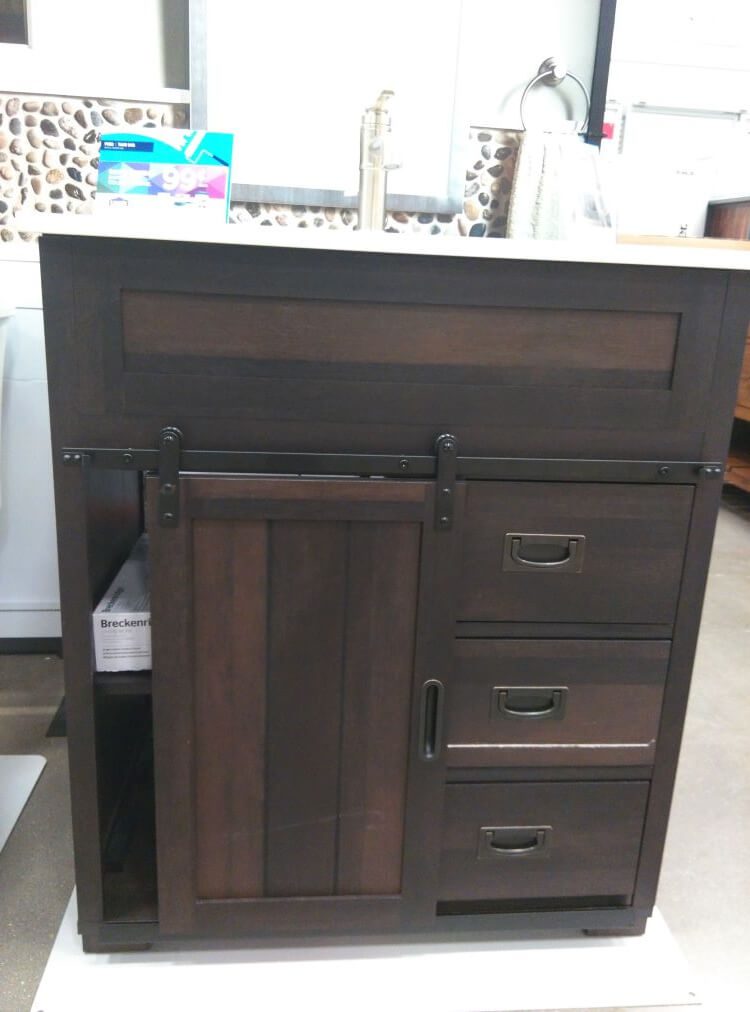 bathroom vanity that includes a “barn door”