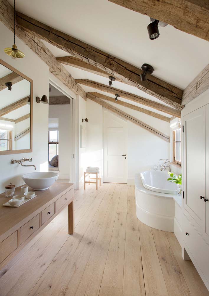 scandinavian farmhouse style bathroom with bathtub exposed wood large window