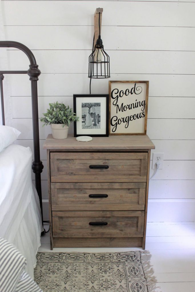 Farmhouse bedroom with nightstand and good morning sign