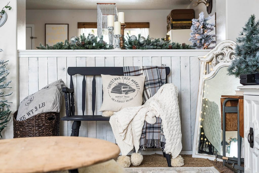 Living room bench with mirror and Christmas pillows