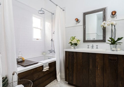 Bathroom with a dual shower/tub and rustic wood vanity.