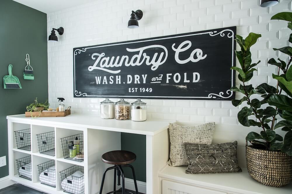 Farmhouse laundry room with blackboard laundry sign.