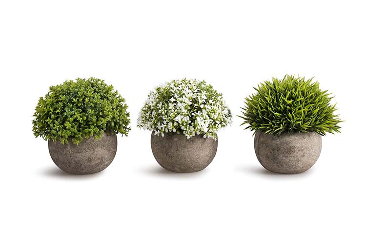 three fake plants and pots scandinavian farmhouse style