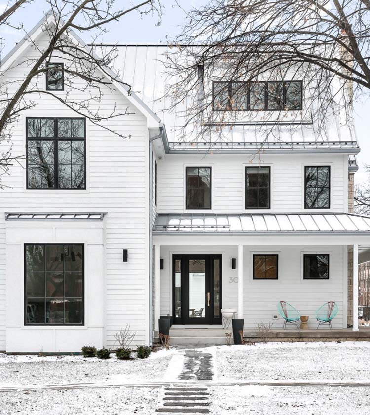 scandinavian farmhouse style exterior with white siding black doors and windows